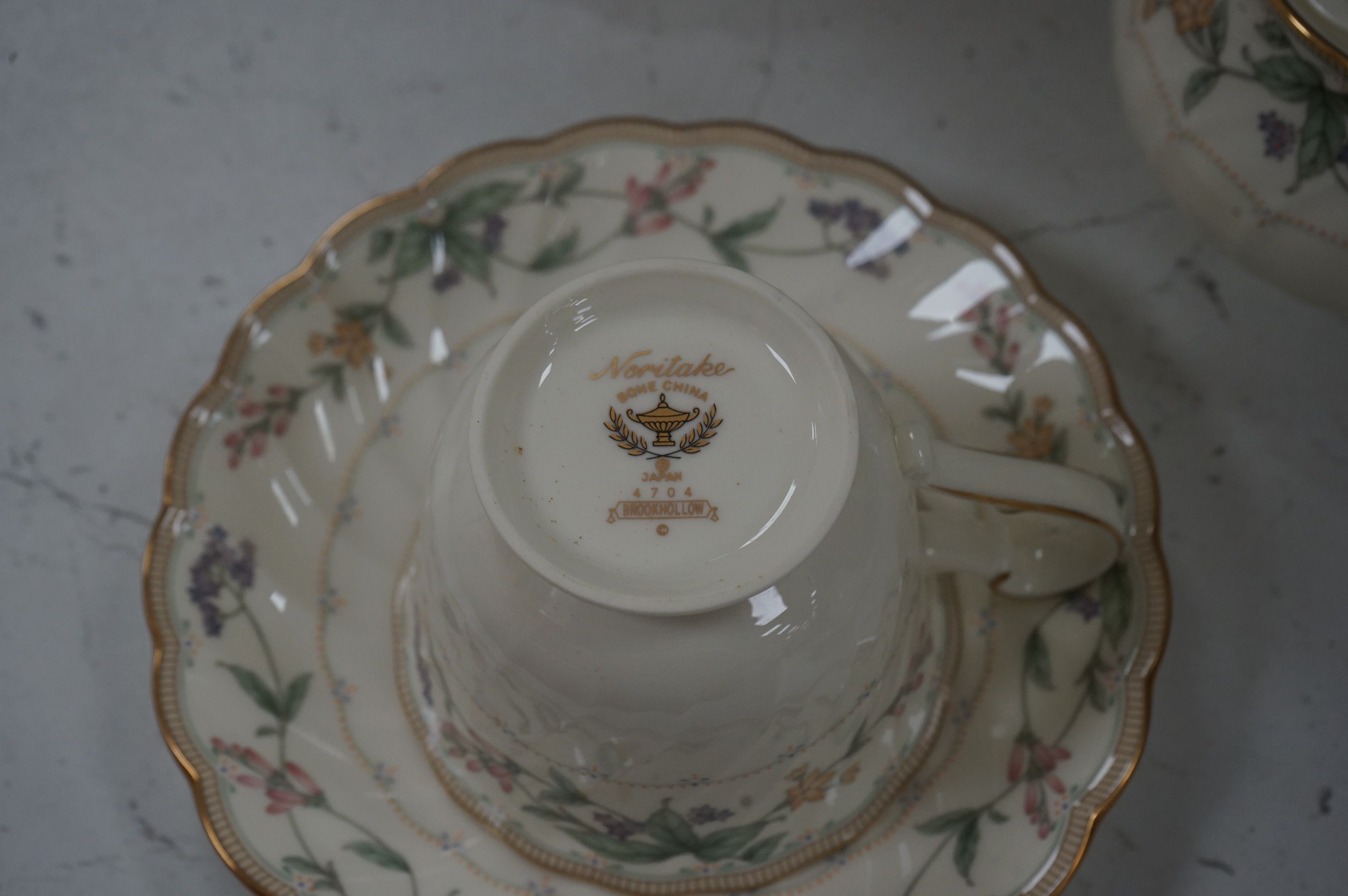 An extensive Noritake ‘ Brookhollow’ floral and gilt decorated dinner and tea service. Condition - good